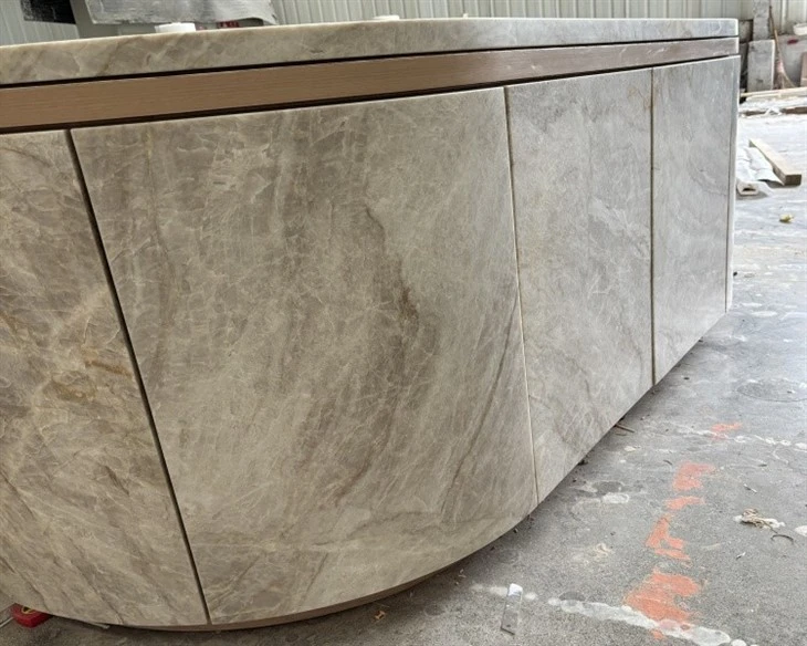 Taj Mahal Quartzite wrapped all stone cabinet